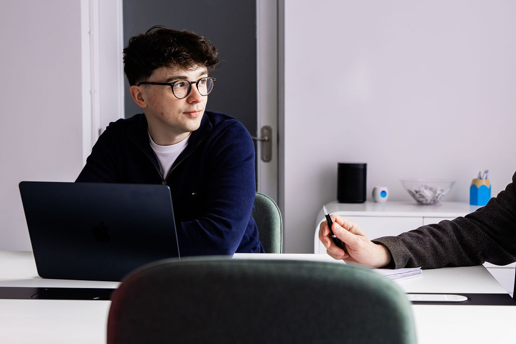 A member of the Schudio team listening in a meeting